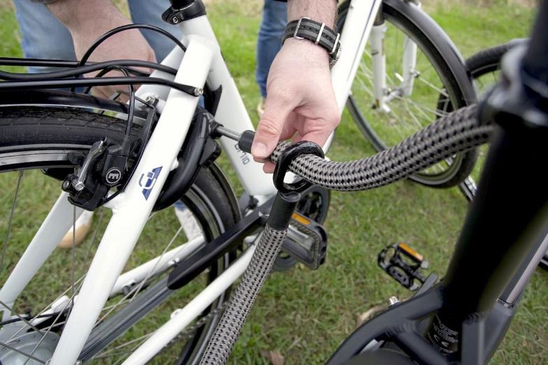 Flexible frame lock extension tex-lock mate  encloses additional bike