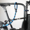 Frame lock with textile adaptor-chain in blue-black secures e-bike to bike stand