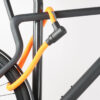 Bikes rear wheel and top tube connected to bike stand with orange textile rope lock